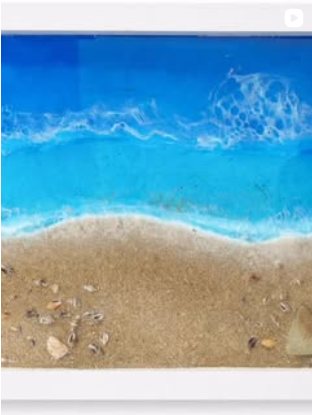 Square framed resin piece with real Cornish sand and shells set into the wave.