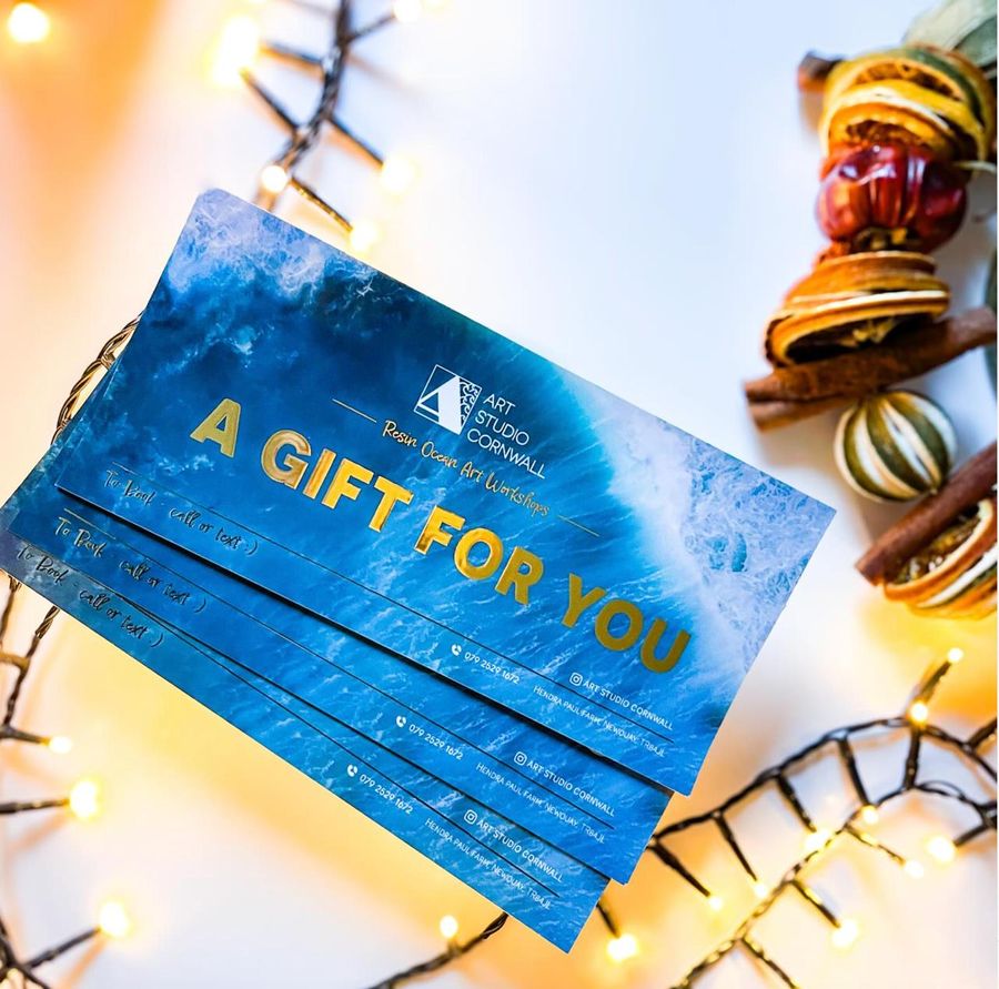 Art Studio Cornwall gold-foil gift vouchers — ‘A Gift For You’ over a teal resin wave.